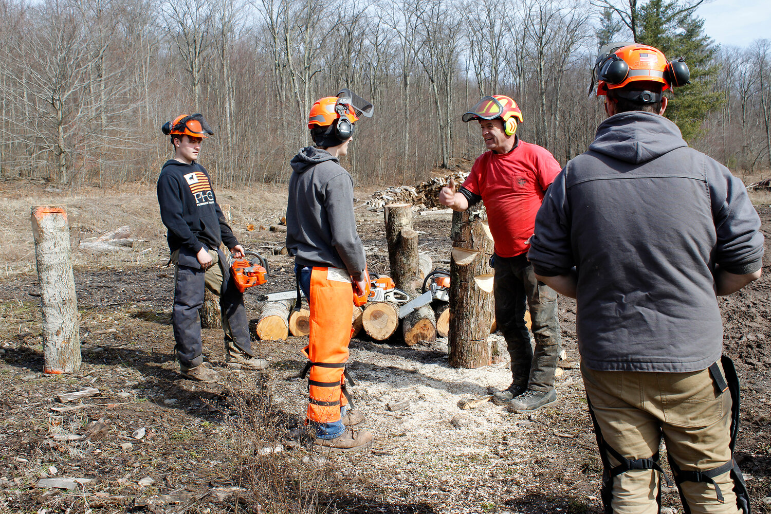 Student Jacob Butts gets the “thumbs up” from Game of Logging instructor Bill Lindloff for his efforts during a chainsaw skills workshop at the DCMO BOCES Harrold Campus last week as Students Aiden Ross and Thomas Breslau look on.